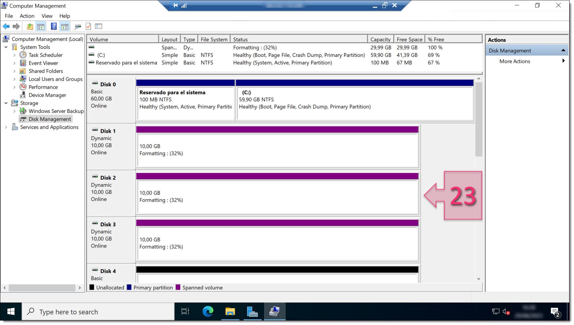 A screenshot of the Computer Management console while a new spanned volume is being created